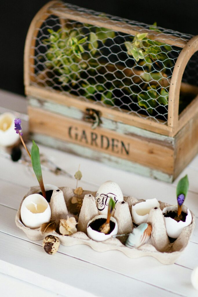 Decorative egg planters in a rustic spring garden setup for Easter decor.