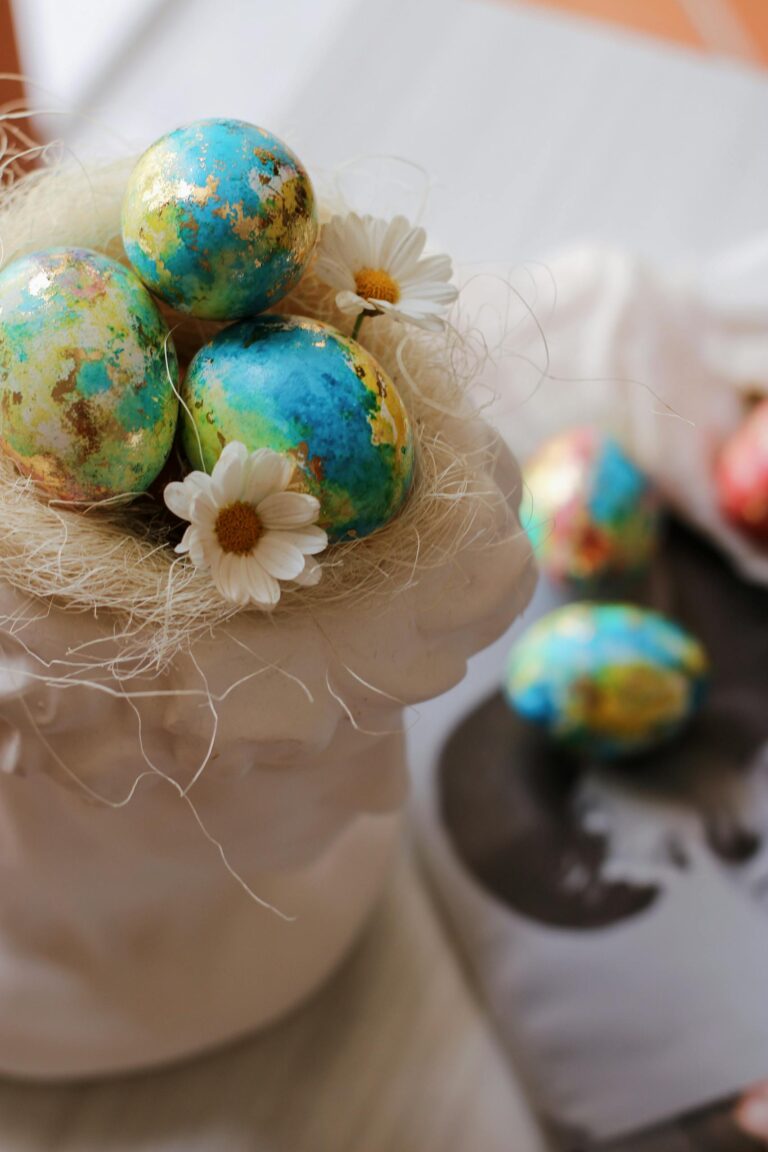 Vibrant Easter eggs nestled with daisies in a decorative holder, perfect for spring celebrations.