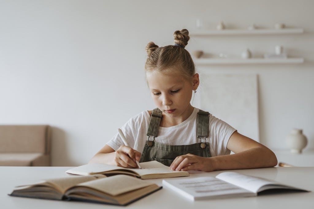 Young girl with braided hair concentrating on her homework at a desk with non-toxic school supplies, highlighting learning at home.