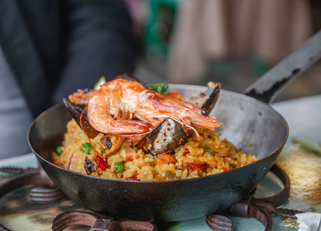 Savory seafood paella with shrimp and mussels, perfectly cooked in a carbon steel pan.