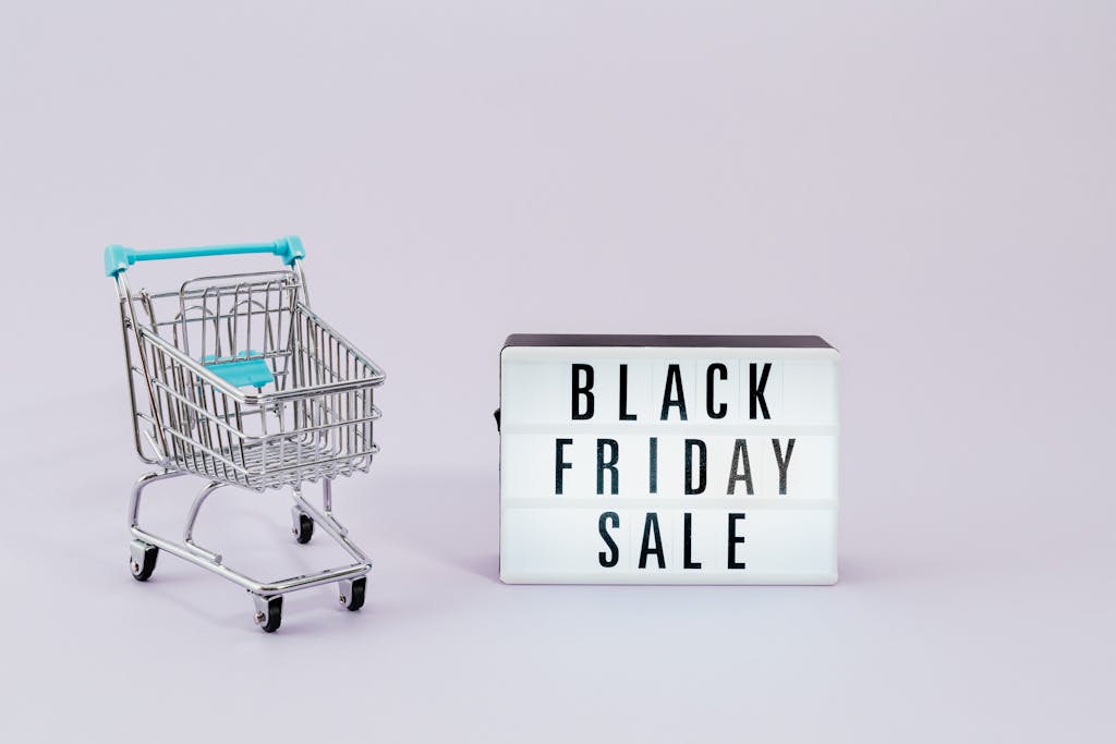 Minimalist image of shopping cart and Black Friday sale sign, perfect for promoting non-toxic Black Friday deals and Cyber Monday sales.