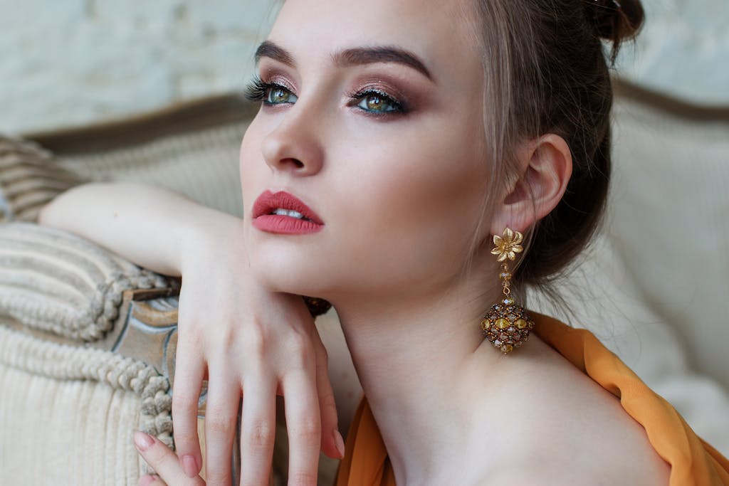 Stunning close-up portrait of a woman with non-toxic makeup and jewelry, epitomizing modern fashion and holiday gifting.