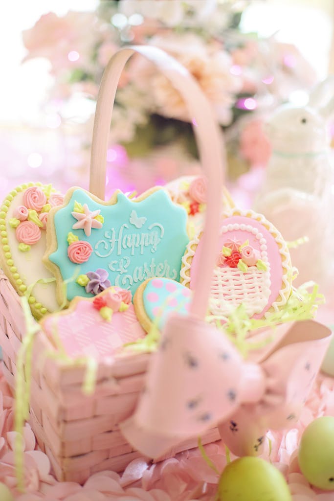 A pastel Easter basket filled with elegant decorated cookies perfect for the holiday season.
