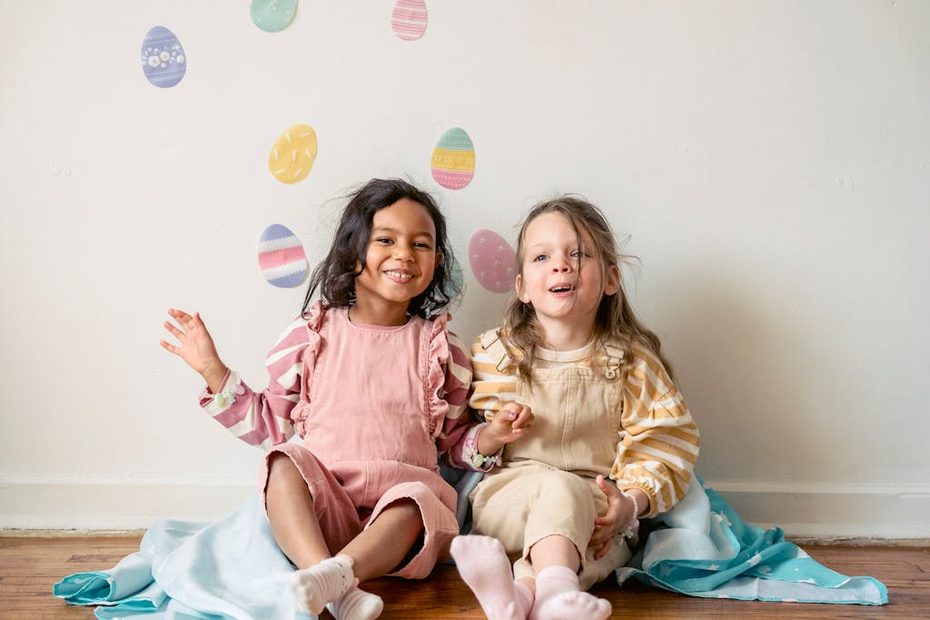 Happy children in Easter-themed decor indoors, smiling and joyful.